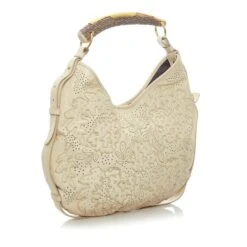 Yves Saint Laurent Sac à Bandoulière Fleuri Perforé En Cuir Beige 13 Yves Saint Laurent Sac à Bandoulière Fleuri Perforé En Cuir Beige -Yves Saint Laurent 859118 2